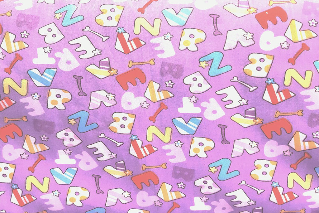 Rainbow Fabrics Letters On Light Orchid Printed Cotton
