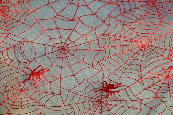 Rainbow Fabrics EO: Orange Spider Webs Organza Black Fabric
