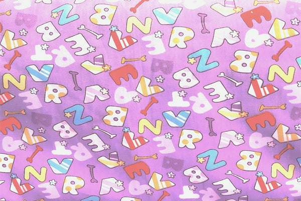 Rainbow Fabrics Letters On Light Orchid Printed Cotton