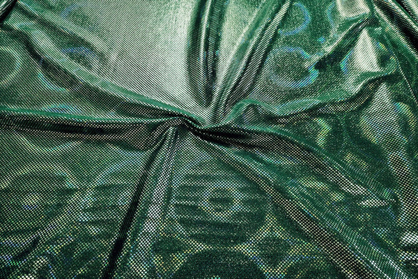Rianbow Fabrics LF: Liquid Foil Spandex - Round Hollogram Specs on Dark Green